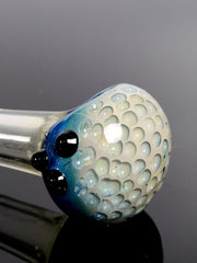Clear glass spoon with blue bubble bowl and black marbles