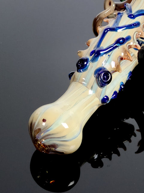 Creature pipe with swirls and tentacles